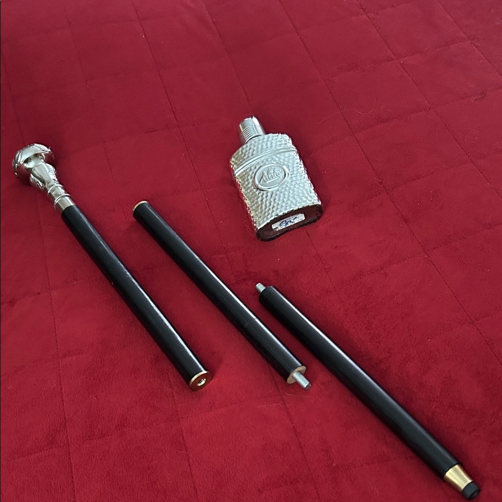 Silver and Black Walking Cane with vintage cologne bottle for free.